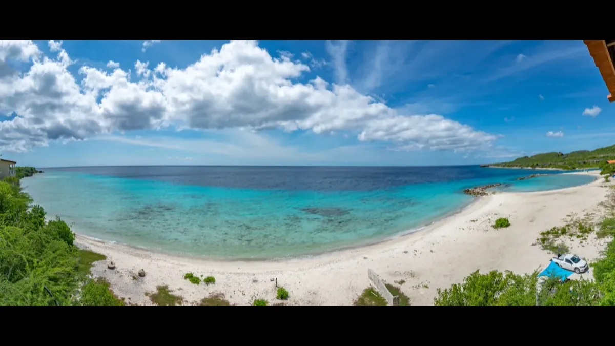 Curaçao turquoise ocean — DI Card guide for Surinamese citizens